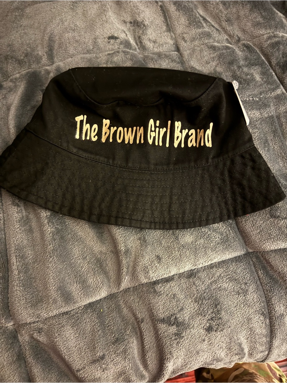 The Brown Girl Brand Black Bucket Hat with Gold Logo